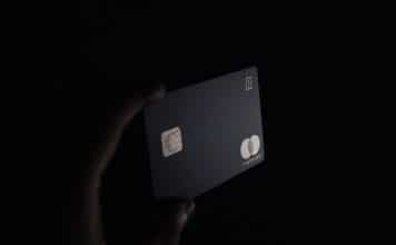 person holding black card