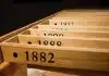 a row of wooden drawers with numbers on them