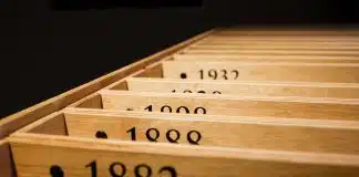 a row of wooden drawers with numbers on them