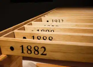 a row of wooden drawers with numbers on them