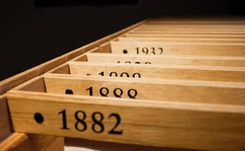 a row of wooden drawers with numbers on them